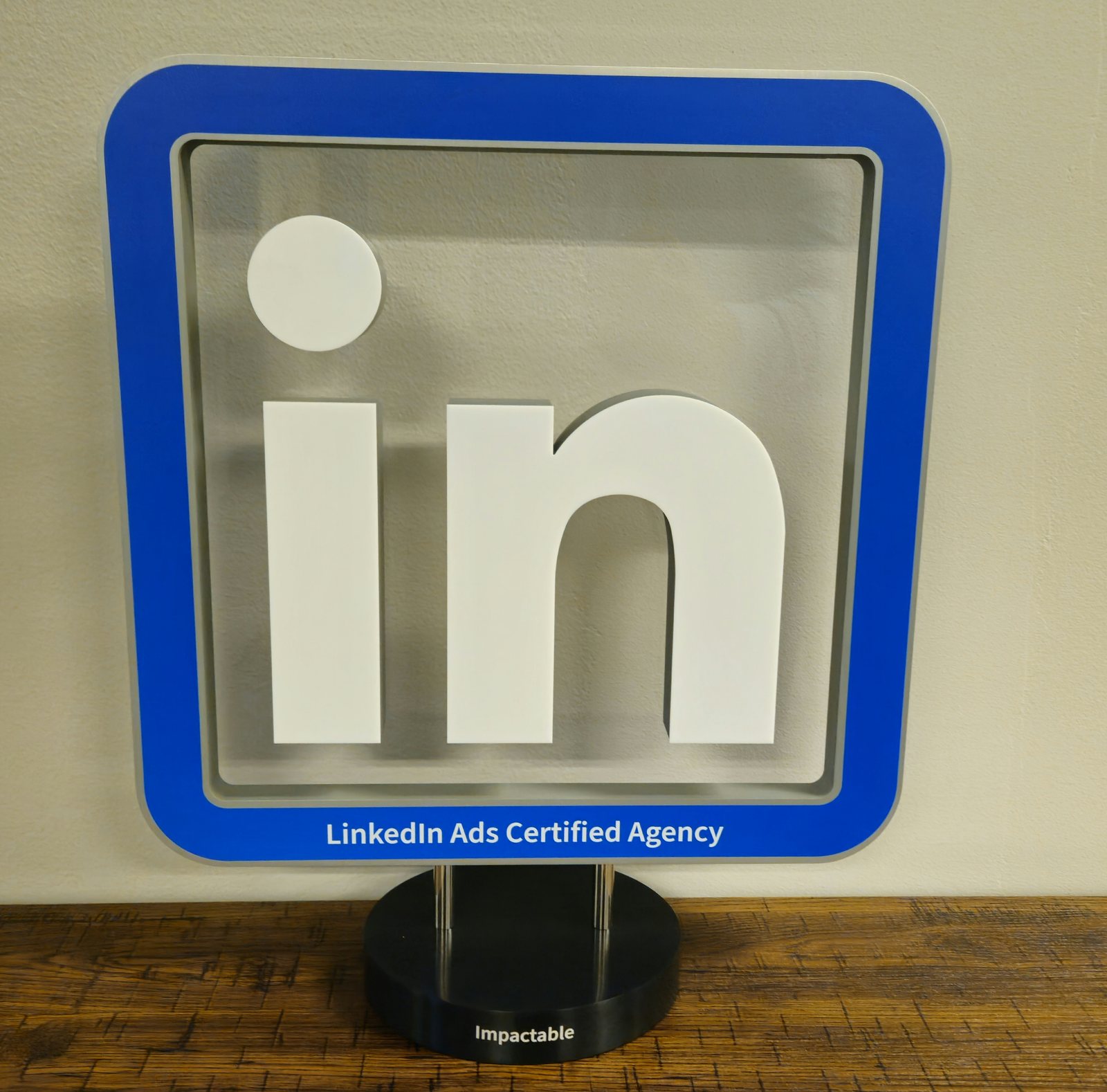 Impactable's LinkedIn Ads Certified Agency award, engraved with the Impactable name